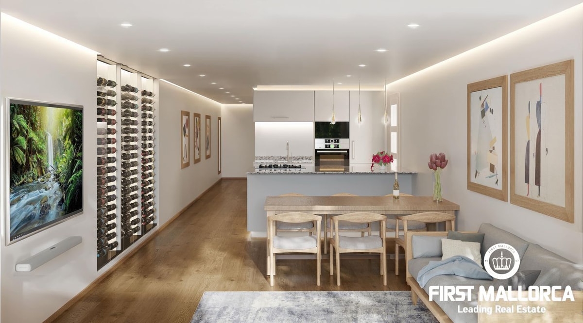 Modern open-plan living and kitchen space with integrated wine storage, wooden dining table, and contemporary sofa.