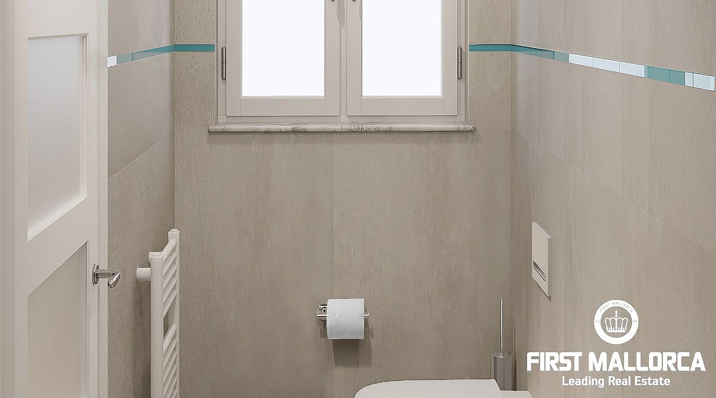 Interior view of a minimalist bathroom featuring grey stone tiles, a white wall-mounted toilet, and a small window.