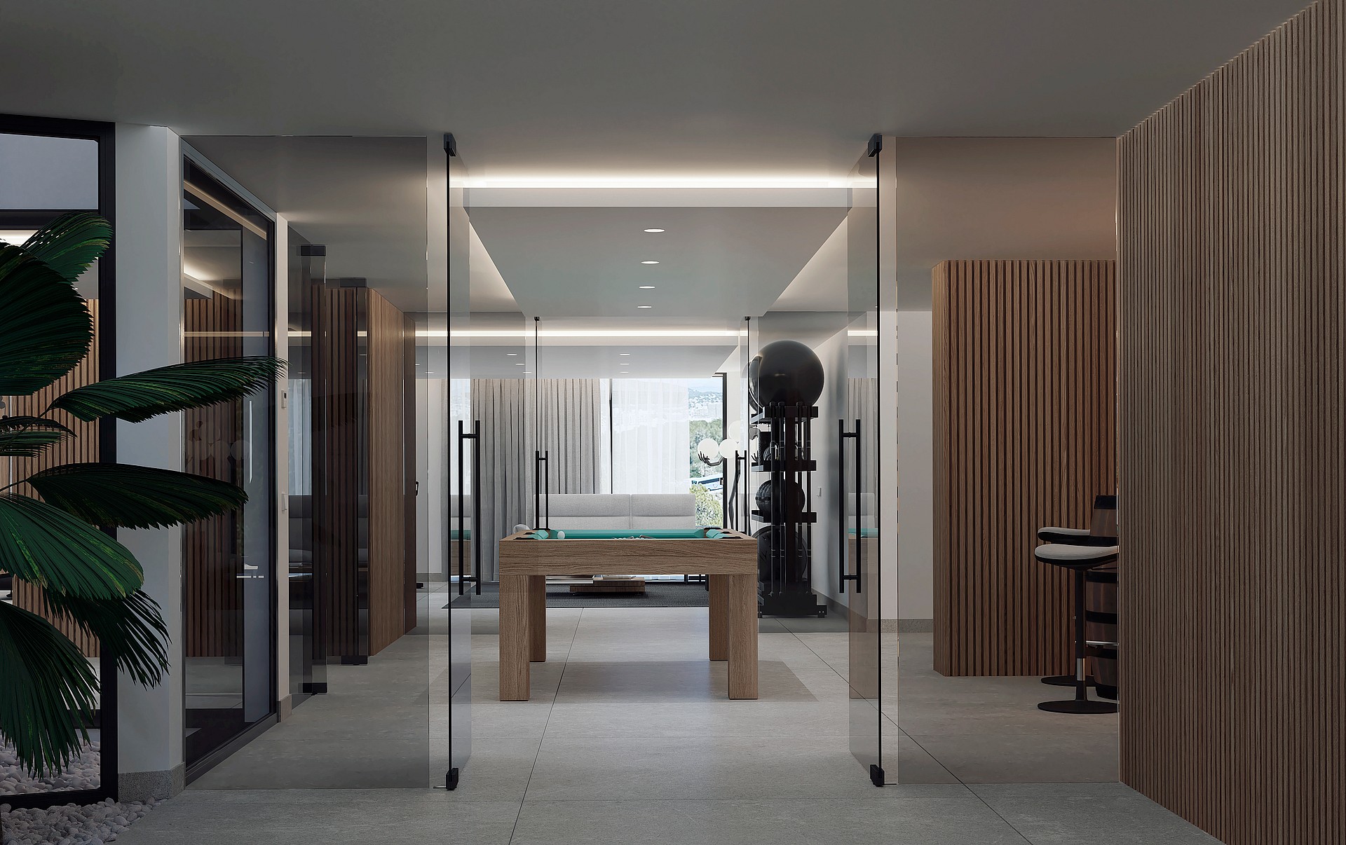 A modern games room featuring a wooden pool table and gym equipment, viewed through frameless glass pivot doors.