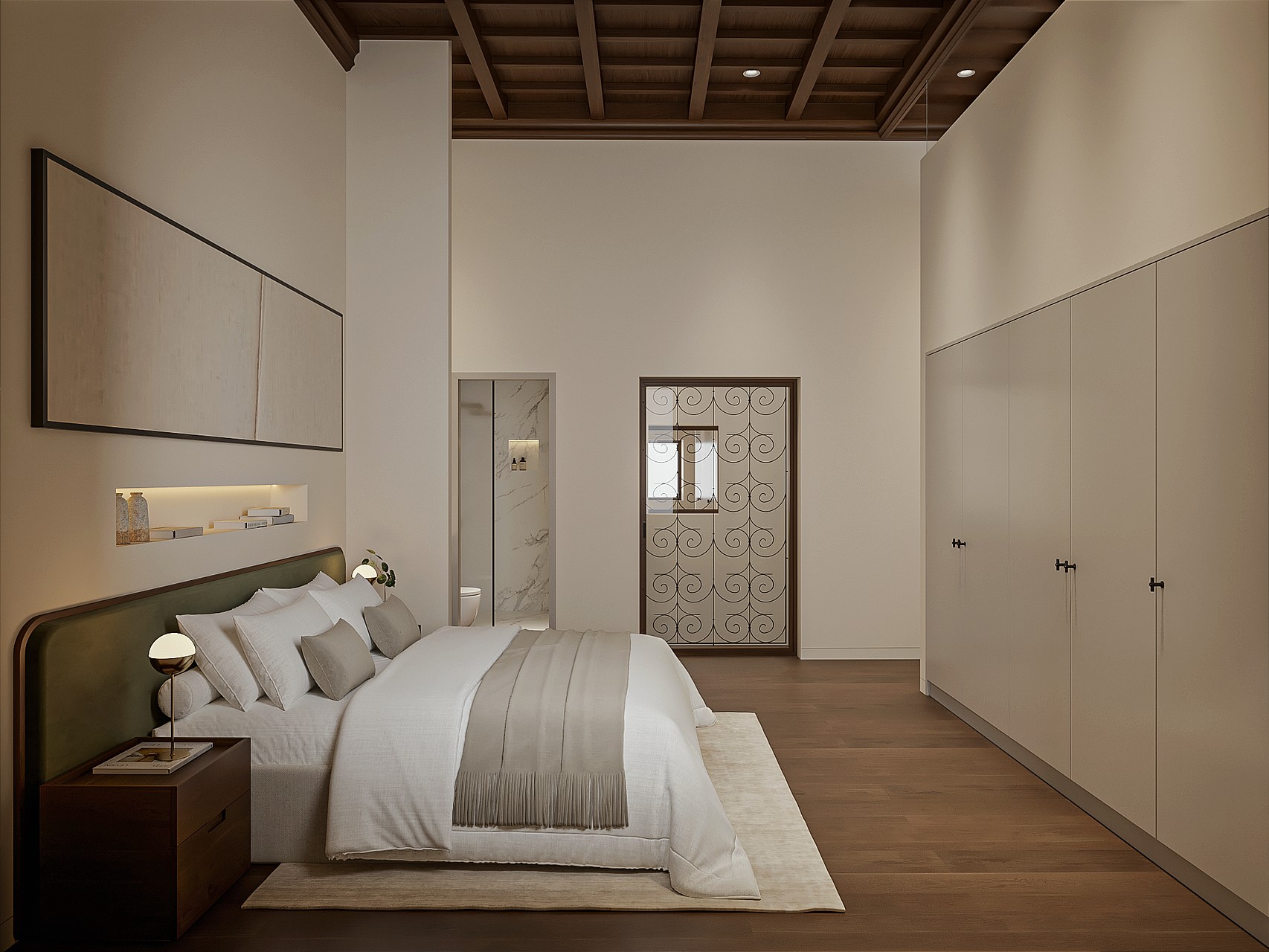 Principal bedroom with green upholstered headboard, coffered wooden ceiling, fitted wardrobes and an en-suite with marble shower through the doorway.
