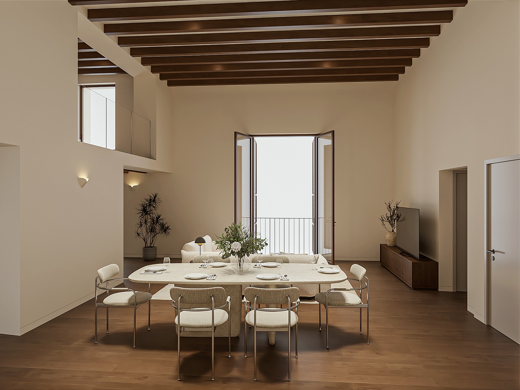 Double-height living and dining room with travertine table, pale sofa, exposed beams, tall balcony doors and an internal mezzanine window high on the wall.