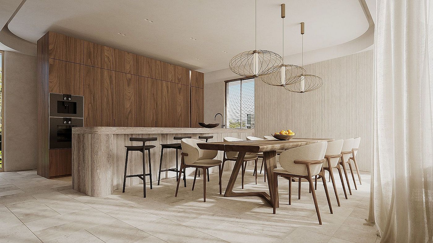 Interior view of an open-plan kitchen with a stone island, wooden cabinetry, and adjacent wooden dining table with chairs.