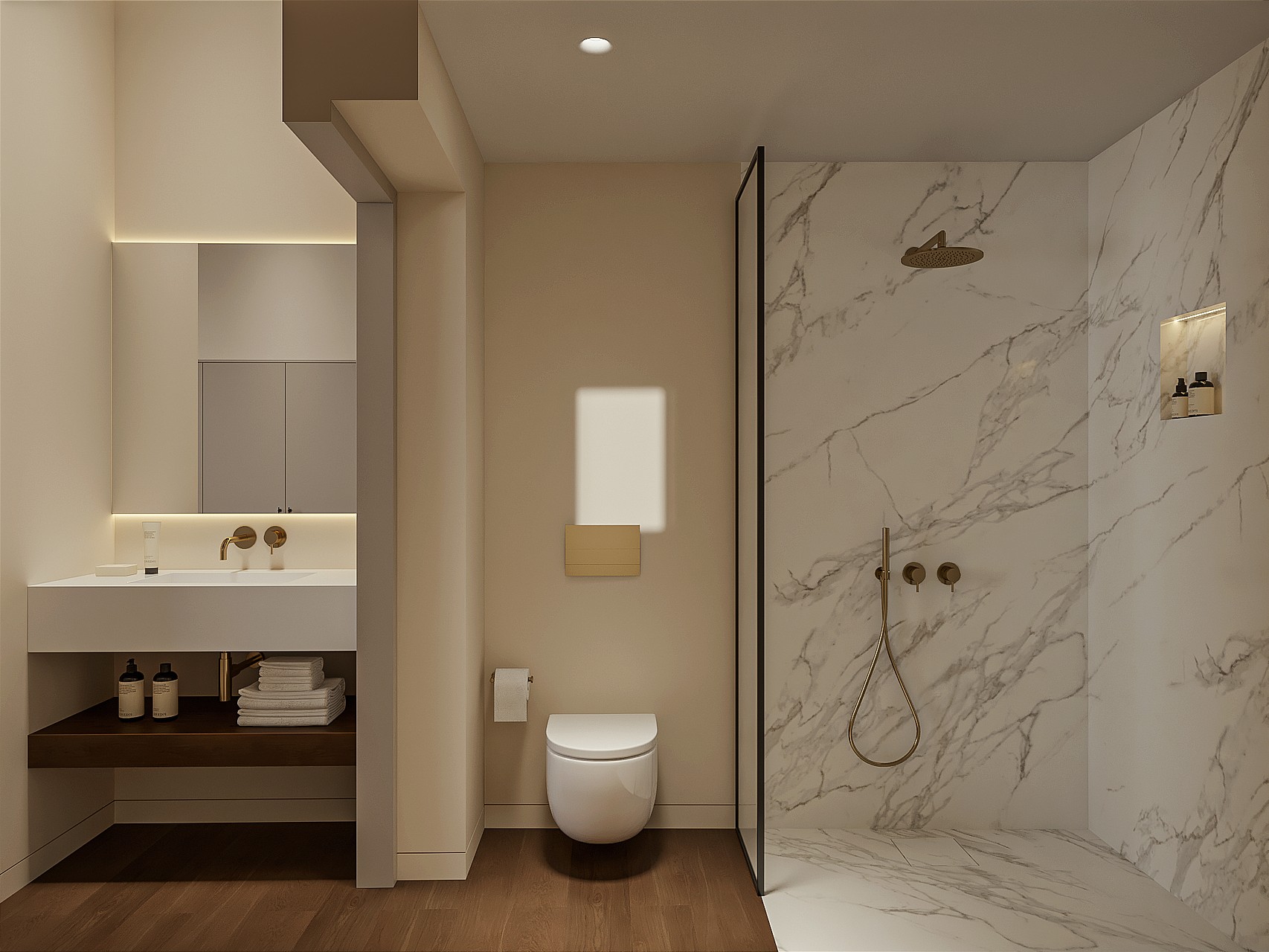Marble en-suite bathroom with walk-in shower, brushed brass fittings, wall-hung WC and a floating basin under a backlit mirror.