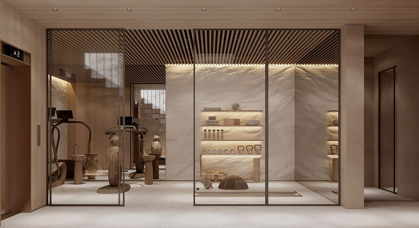 Interior view of a modern wellness facility featuring glass-partitioned sauna, gym equipment, and integrated warm lighting.