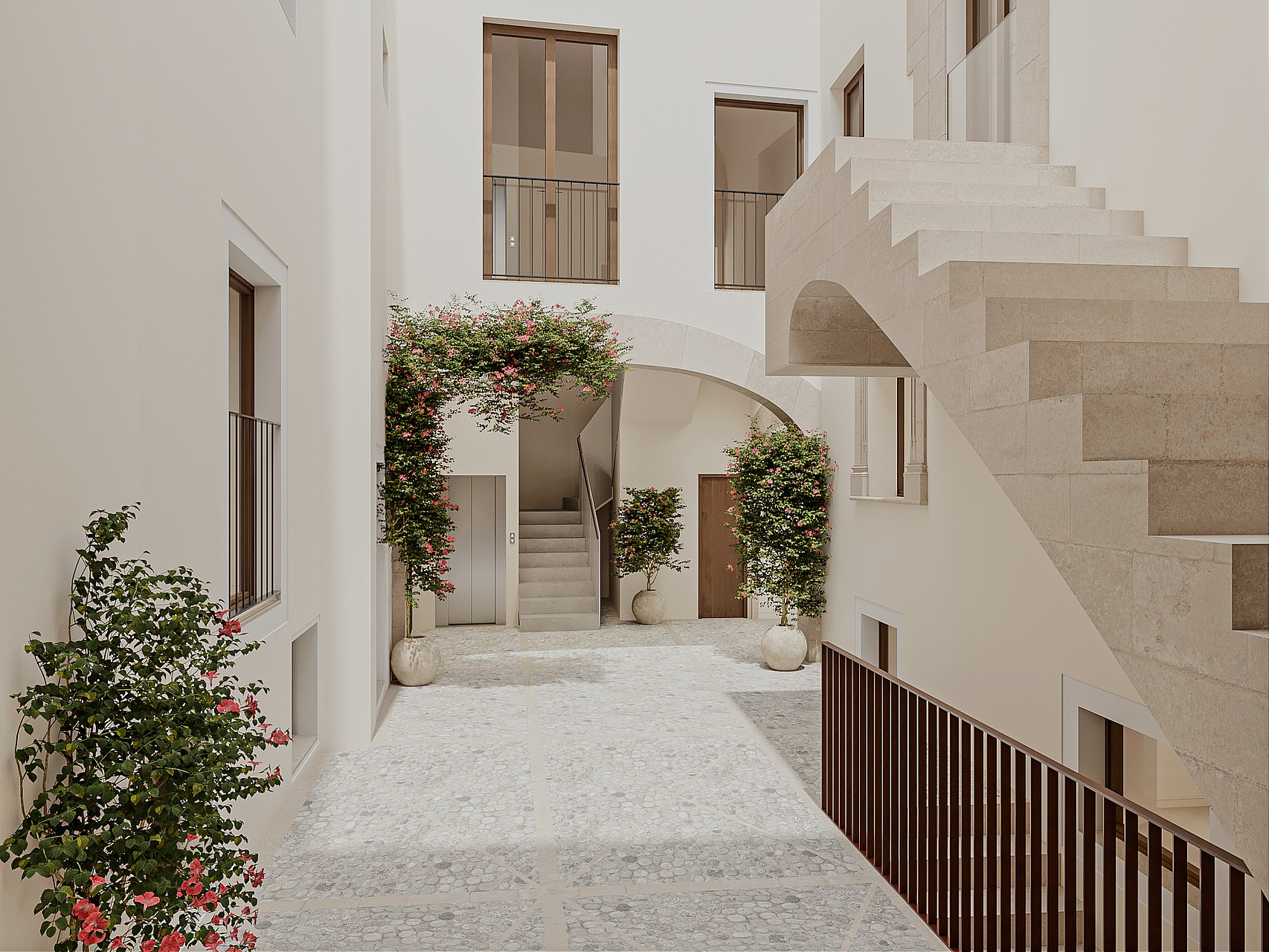 Interior courtyard featuring Marés stone, stone stairs, and greenery within a restored historic building.