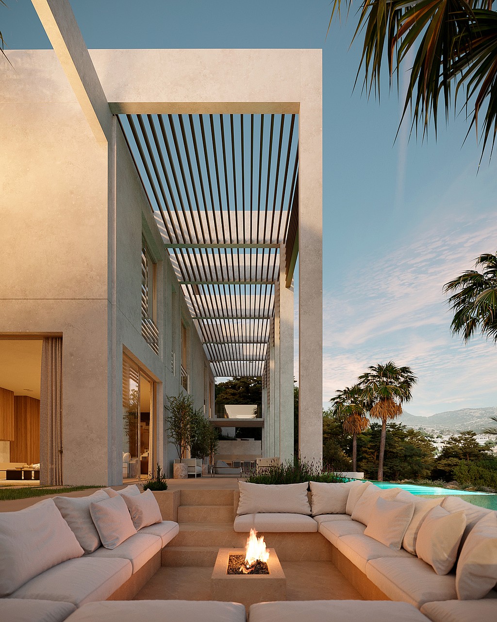 Modern villa exterior with a slatted pergola walkway, sunken fire pit lounge, and pool overlooking distant mountains.