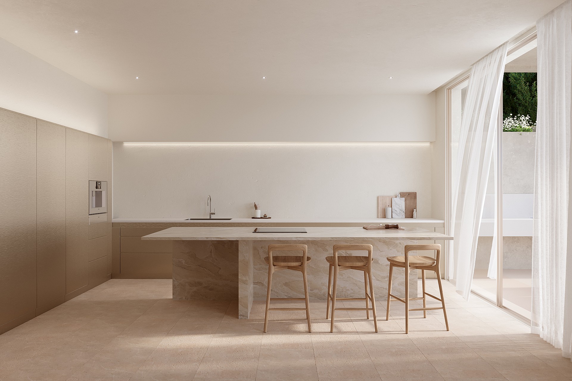 Stone kitchen island with three wooden stools beside floor-to-ceiling windows with sheer white curtains.