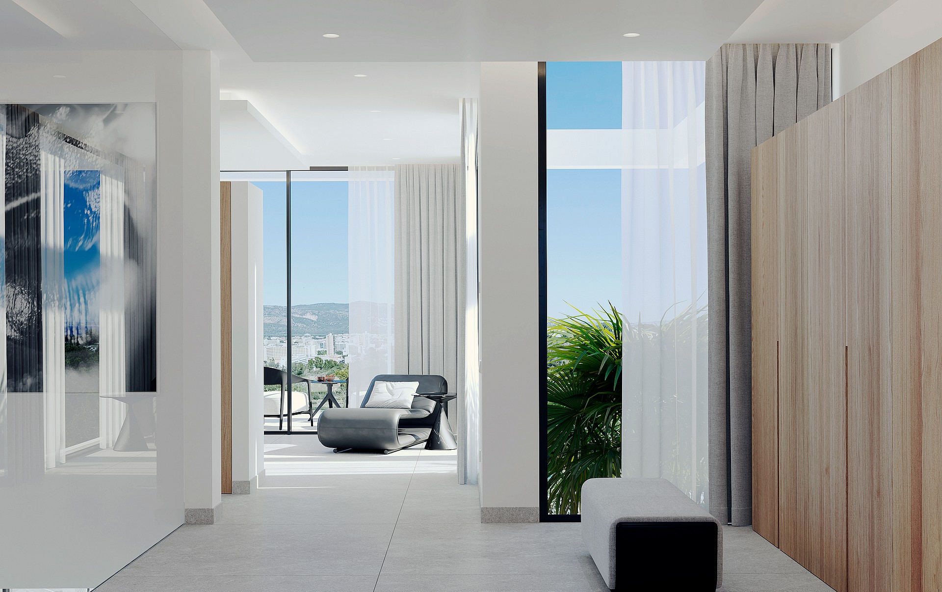 Modern interior space with light grey tile floors, featuring a dark grey lounge chair on a sunlit terrace visible through full-height sliding glass doors.