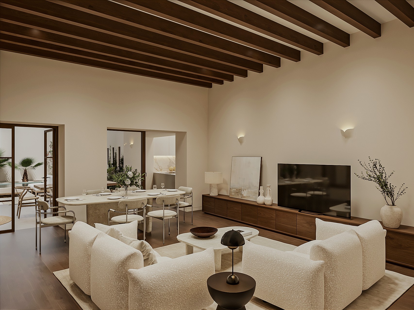 Open living and dining room with pale sofas, oval travertine table, walnut media unit and exposed wooden beams, glazed doors to a terrace and pool.