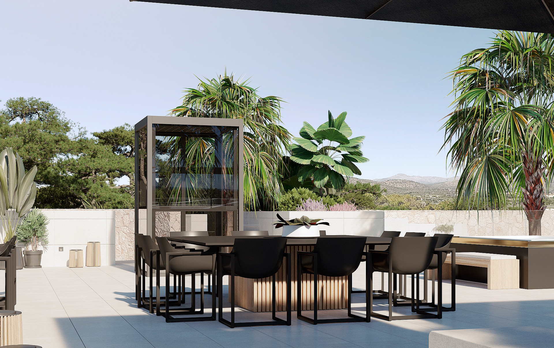 An outdoor dining area with a square table and dark modern chairs on a stone-tiled terrace, framed by palm trees and mountains.