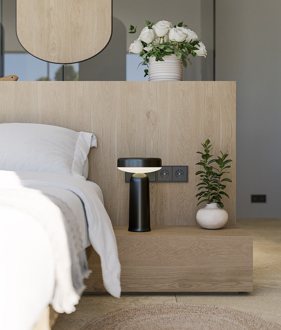 Close-up of a modern bedside setup with a textured oak headboard, black designer lamp, and a small ceramic vase.