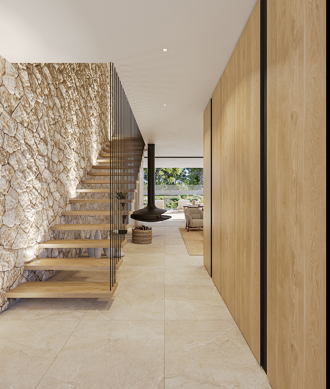 A wide entrance hall featuring a rough-hewn stone wall, wooden floating staircase with black railings, and tall oak cabinetry.