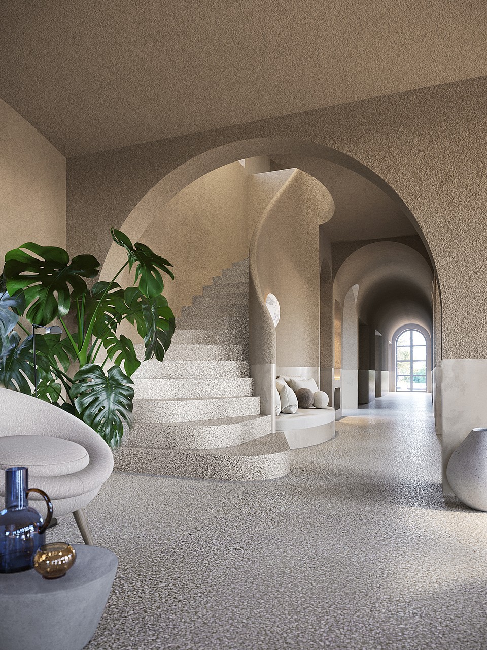 Interior foyer of a finca in Santa Maria featuring a curved stone staircase under an archway, textured walls, and a potted monstera plant.