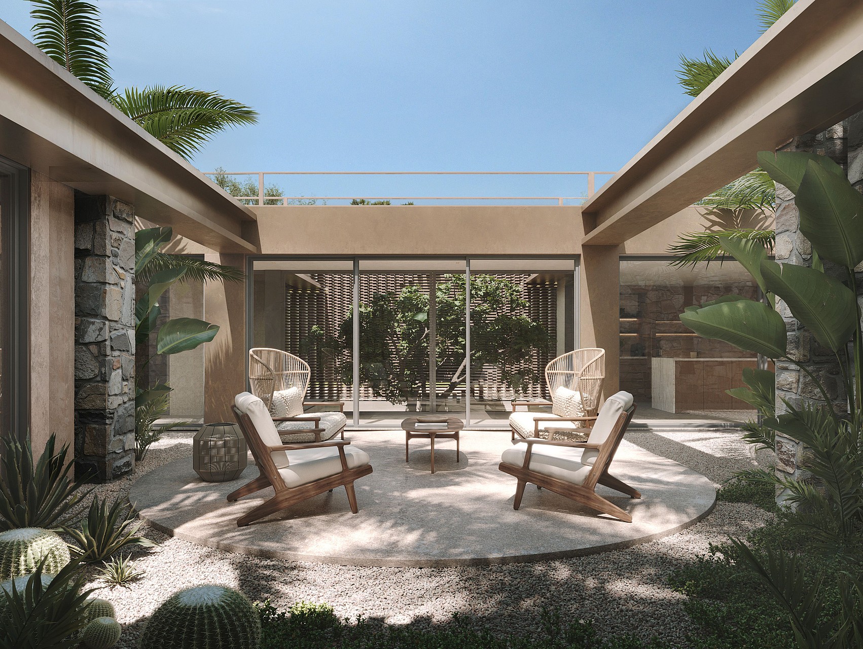 A modern central courtyard featuring a gravel ground, four wooden lounge chairs, and desert-inspired landscaping.