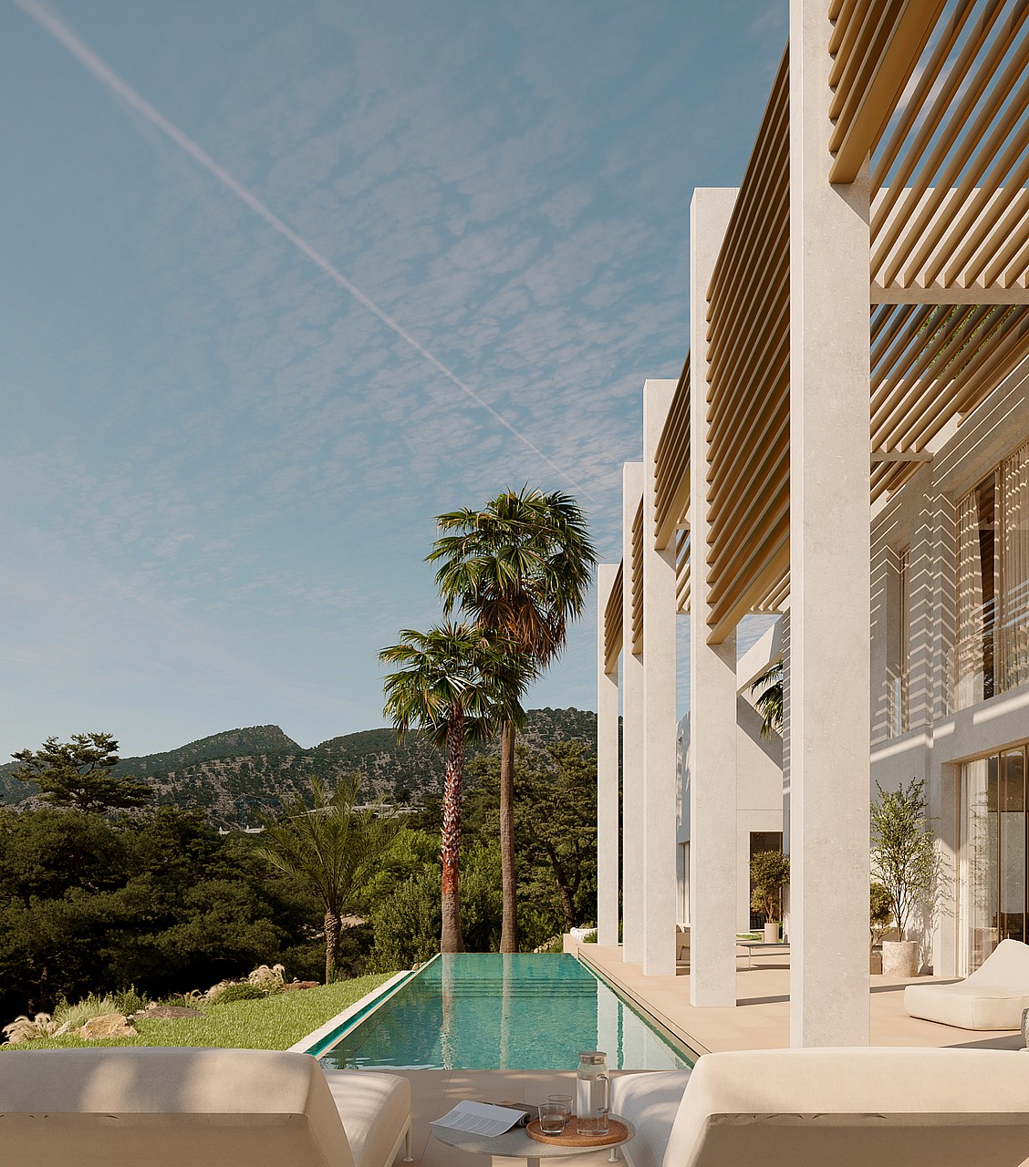 Rectangular turquoise lap pool beside a white modern villa with wooden pergolas, palm trees, and mountain views.