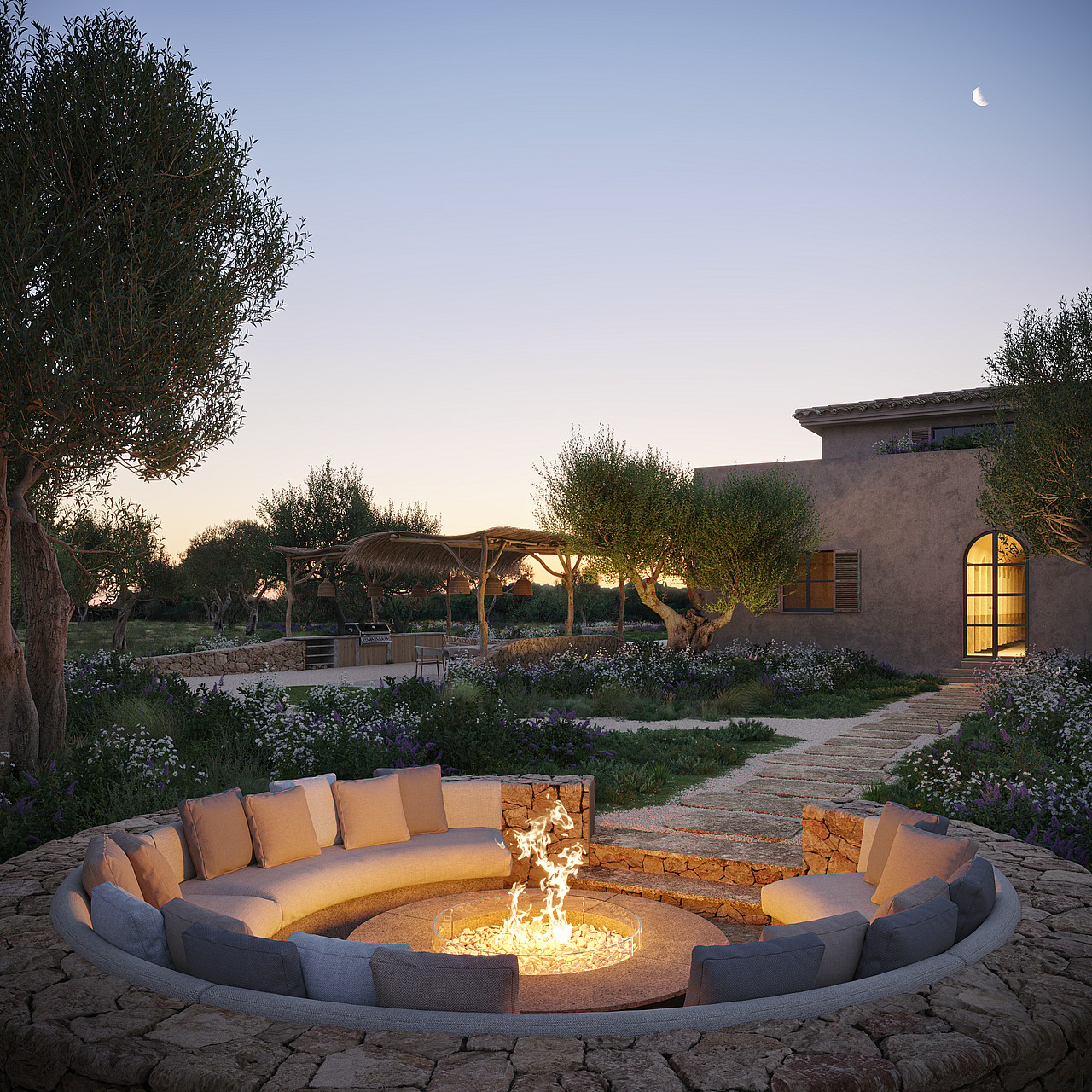 A circular stone-built fire pit with built-in seating nestled in a Mediterranean garden at dusk.