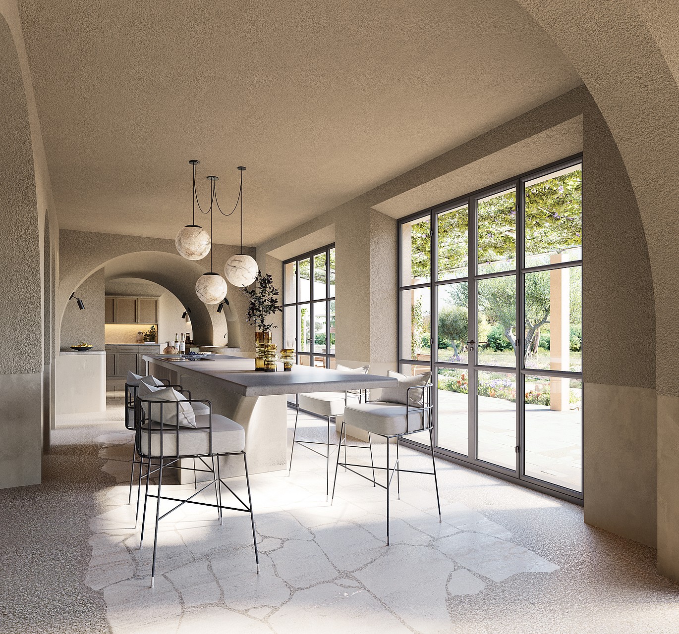 A bright kitchen area with arched stone ceilings, stone floors, and black-framed glass doors leading to a garden.