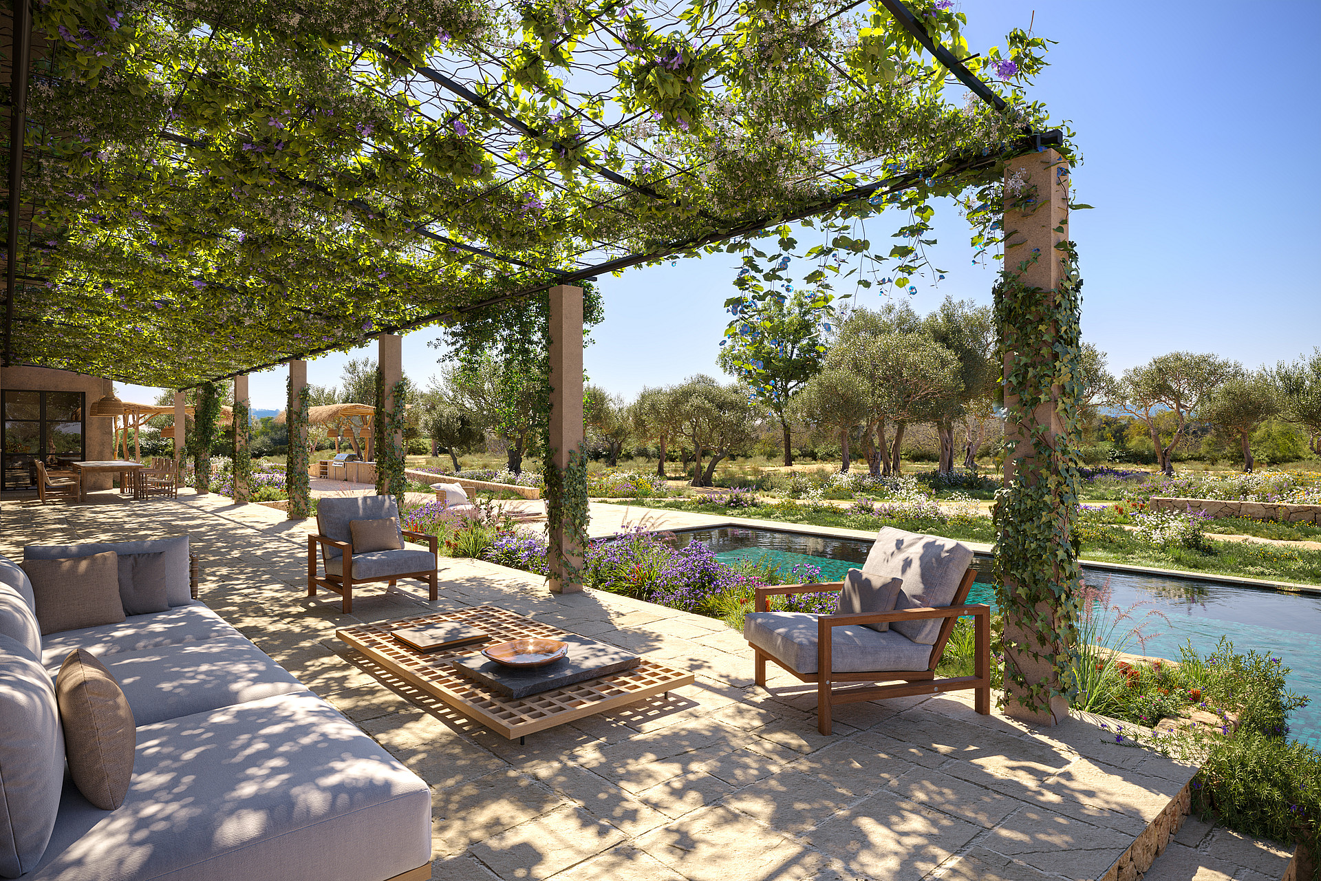 A stone terrace featuring a wooden pergola draped in vines, shaded outdoor seating, and a long swimming pool overlooking trees.