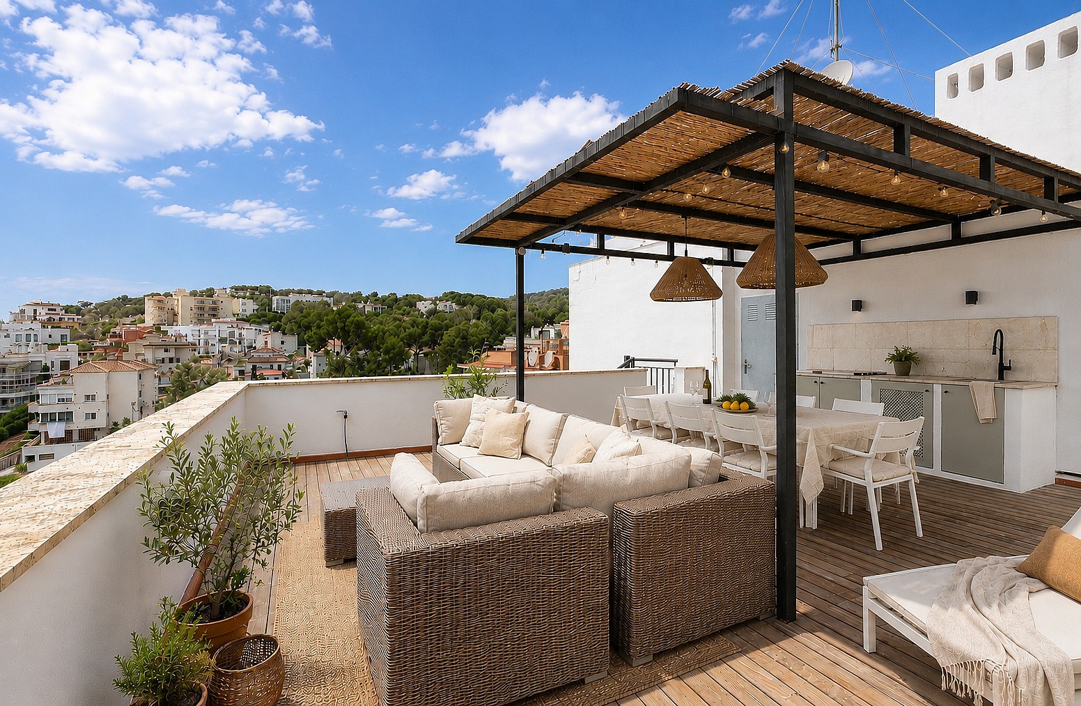 A spacious rooftop terrace in San Agustin with a wicker sofa set, a dining table under a thatched pergola, and a built-in outdoor kitchen.