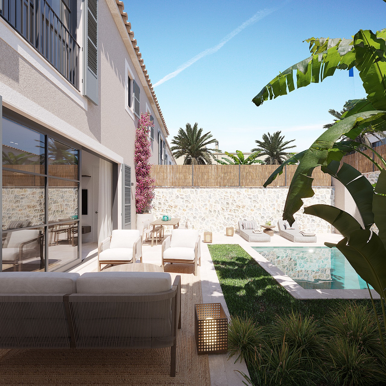 Piscine privée avec palmiers, terrasse couverte et jardin paysager derrière une maison à Palma