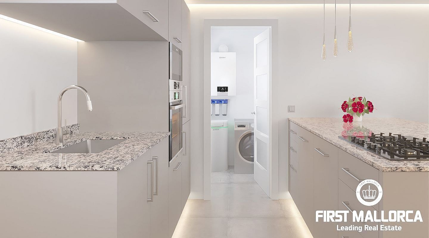 A contemporary galley-style kitchen featuring granite countertops, light cabinetry, and an open doorway leading to a utility area.