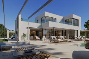 Exterior view of a modern white villa in Son Gual featuring a ground floor terrace, swimming pool, and mountain views.