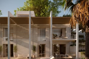A white two-story villa exterior featuring a large wooden pergola, glass balconies, and a poolside terrace with sun loungers.