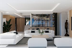 Spacious living room featuring white modular sofas, a central coffee table, and a dedicated bar area with glass shelving and wood-paneled walls.