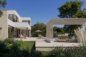 Contemporary two-story villa in Son Gual with clean white lines, large glass windows, and an outdoor terrace with pergola.