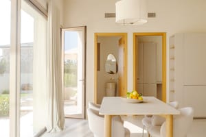 The ground floor features a spectacular open-plan living, dining, and kitchen area