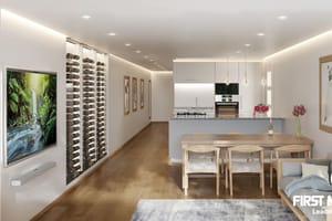 Modern open-plan living and kitchen space with integrated wine storage, wooden dining table, and contemporary sofa.