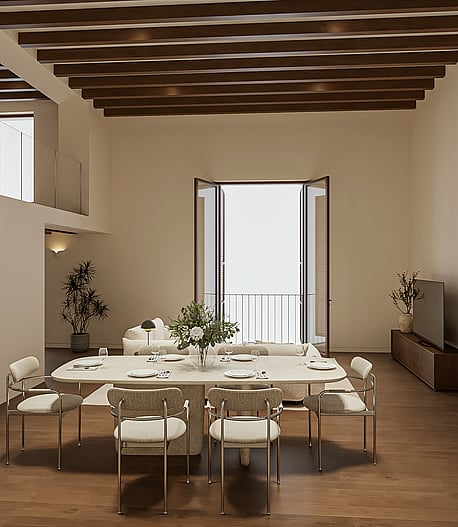 Double-height living and dining room with travertine table, pale sofa, exposed beams, tall balcony doors and an internal mezzanine window high on the wall.