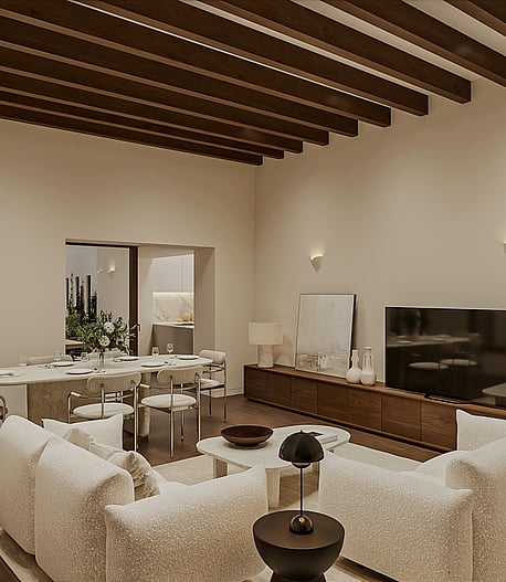 Open living and dining room with pale sofas, oval travertine table, walnut media unit and exposed wooden beams, glazed doors to a terrace and pool.