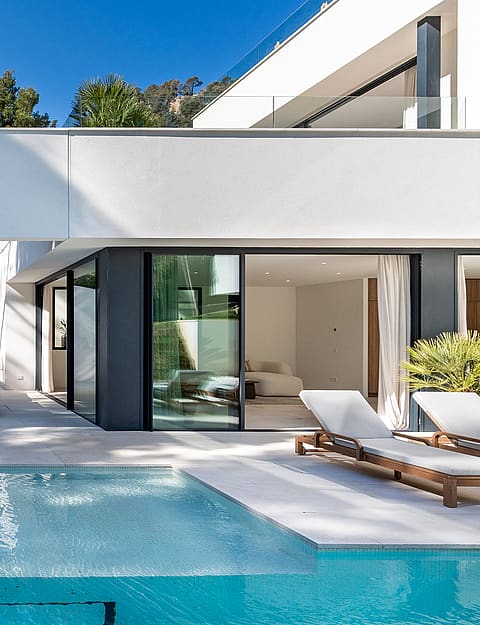 White render contemporary villa with 25-metre outdoor pool, teak loungers and landscaped garden in Son Vida, Mallorca