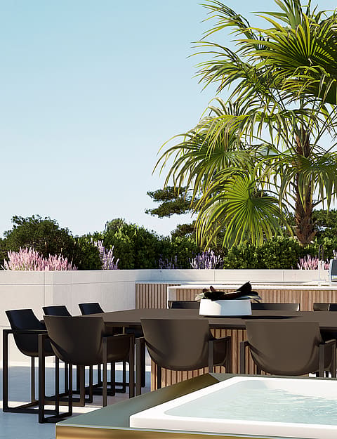 A rooftop terrace featuring a dark dining table and chairs, adjacent to a small pool, surrounded by palm trees and greenery.