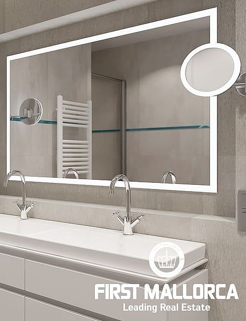 Modern bathroom featuring a double sink vanity, wall-mounted towel warmer, and a large backlit mirror with tile walls.
