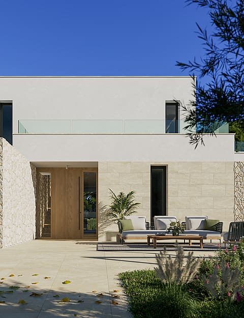 Modern villa exterior with white render and natural stone cladding, featuring a terrace area and olive trees under bright sun.