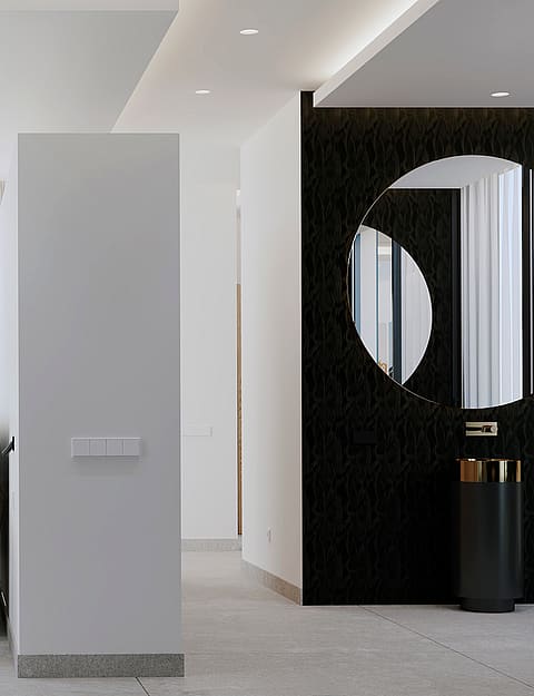 A modern master bedroom featuring a dark textured accent wall with a circular mirror and a pedestal sink.