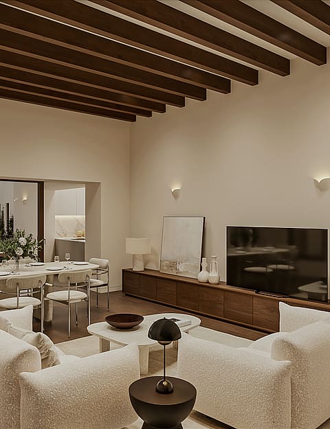 Open living and dining room with pale sofas, oval travertine table, walnut media unit and exposed wooden beams, glazed doors to a terrace and pool.