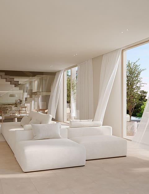 Bright open-plan living room featuring a white modular sofa, floor-to-ceiling windows, and a floating staircase.