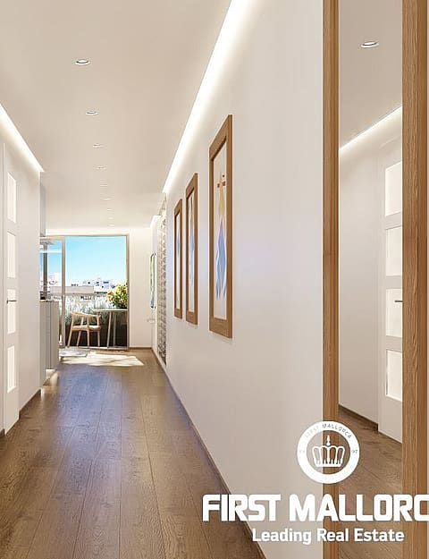 A bright apartment corridor with dark wood flooring, white walls, LED strip lighting, and doors with glass panels.
