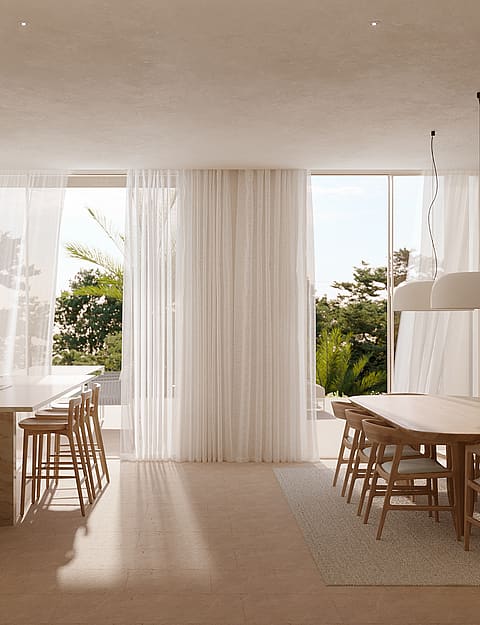 Minimalist interior with a stone kitchen island and wooden dining set near floor-to-ceiling windows with sheer curtains.