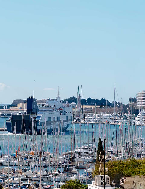 Blue sky in Mallorca with the sea and yacht harbour in Palma