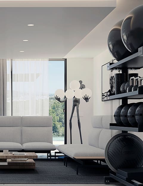 A modern home gym featuring white minimalist sofas, a wooden coffee table, and an organized rack of black kettlebells.