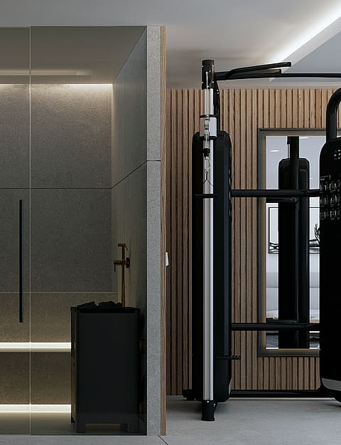 A modern home gym interior with black strength training equipment next to a glass-enclosed shower area featuring stone tiling and hidden LED lighting.
