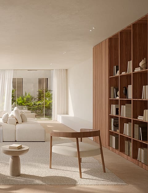 Minimalist living room featuring a modular white sofa, floor-to-ceiling wood shelving, and windows facing a lush garden.
