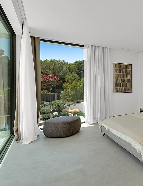 ight-filled en-suite bedroom with sliding glass door onto private terrace