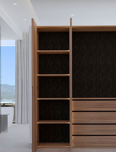 A floor-to-ceiling wooden wardrobe with open shelves and drawers, positioned next to a glass-enclosed bathroom area.