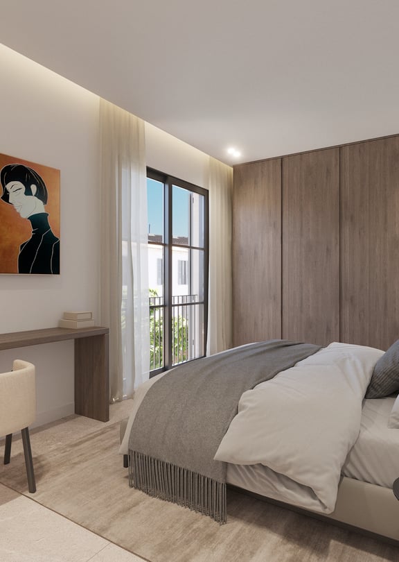 Chambre principale avec tête de lit en bois, linge de lit en lin et tons naturels