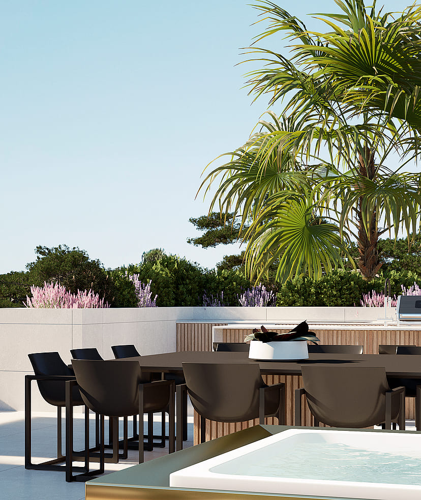 A rooftop terrace featuring a dark dining table and chairs, adjacent to a small pool, surrounded by palm trees and greenery.